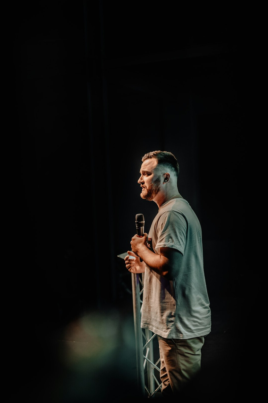 man giving speech on stage